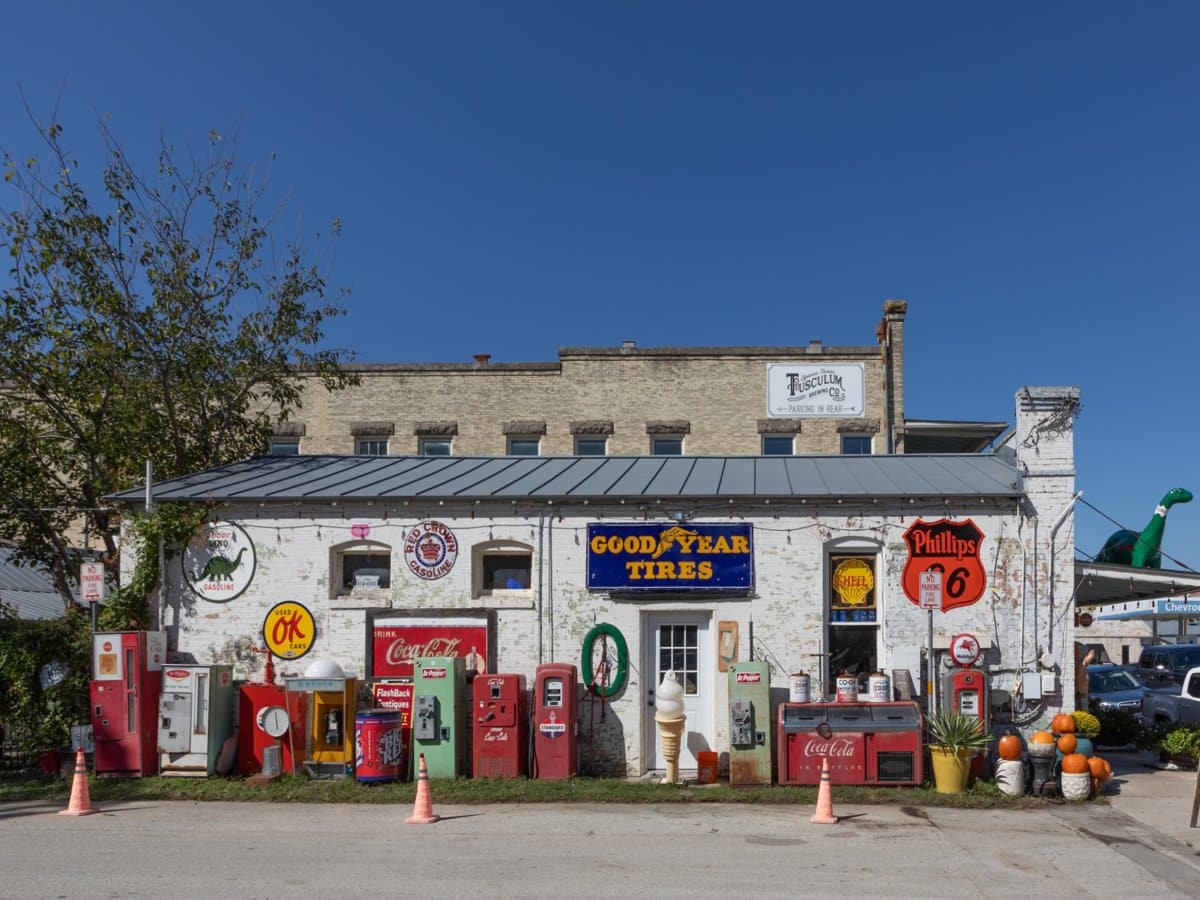 Historic building and vintage gas station scene capturing the charm of Homes for Sale in Boerne