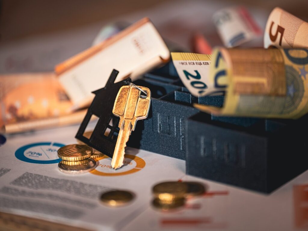 Home investment review Business professional reviewing home buying plans and mortgage documents with clients.