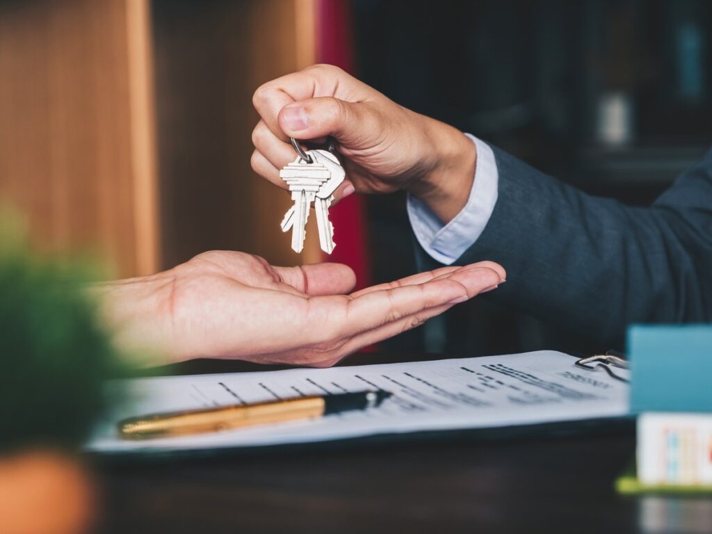 istock_resized Agent showing property details to buyers