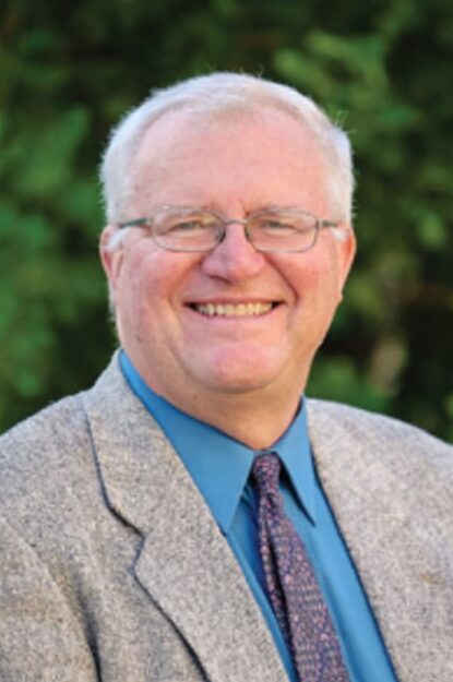 real estate broker in a suit jacket and blue tie
