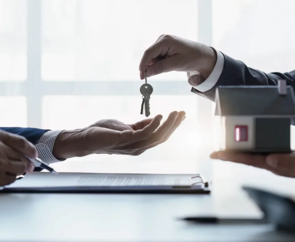 A man handing a key to a woman, category 2 the process